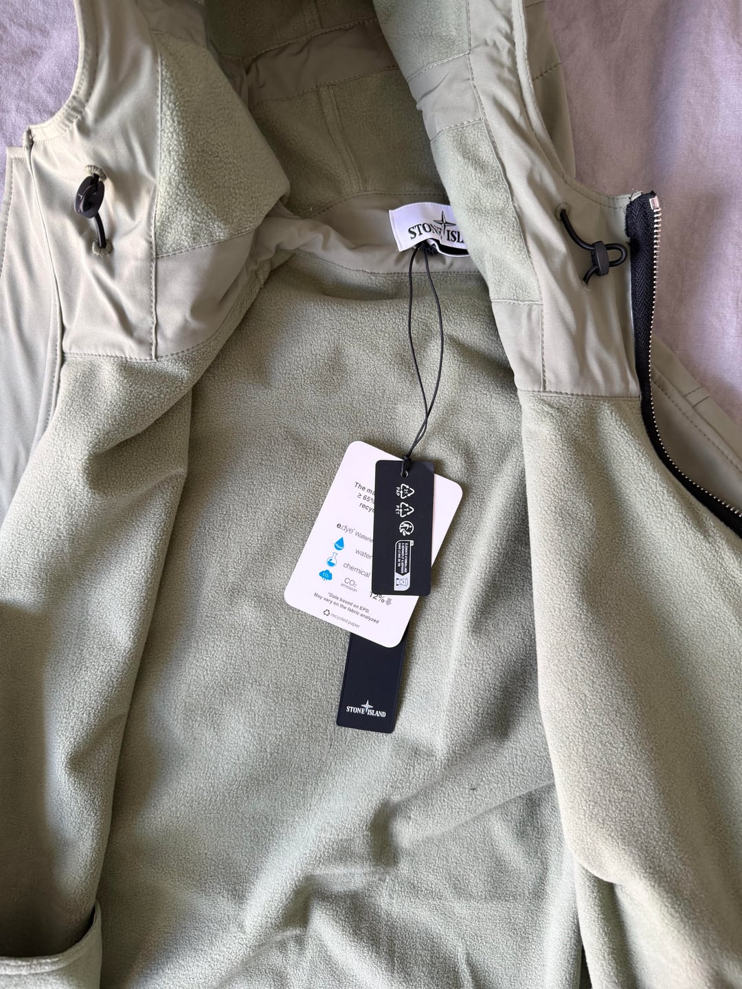 Sage softshell jacket and swing tags