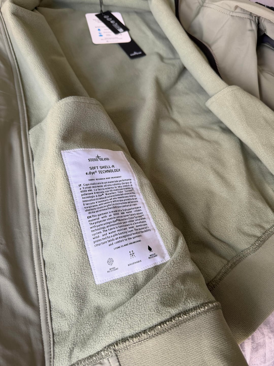 Inside of the sage jacket and its care label
