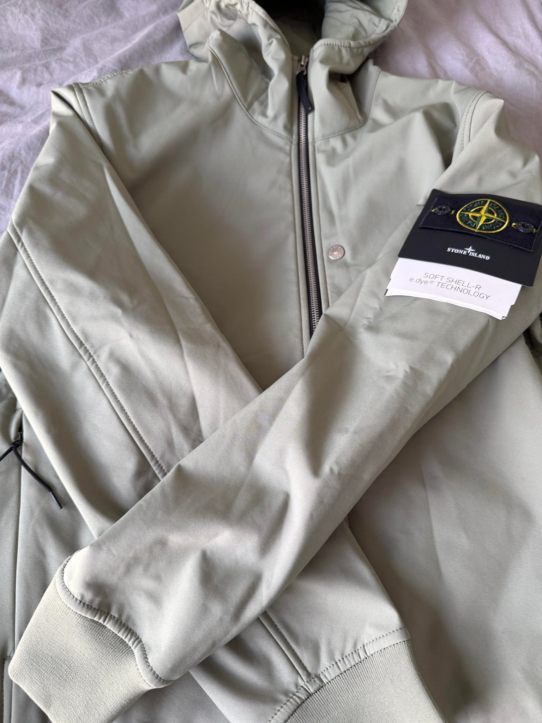 Sage softshell jacket front and sleeve badge