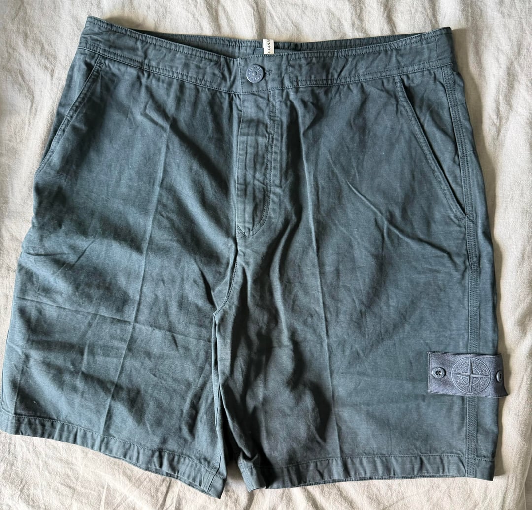 Slate-blue shorts laid flat