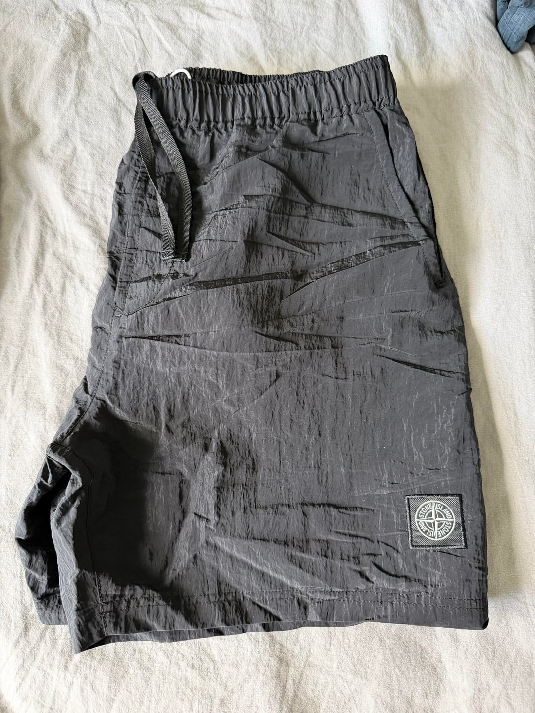 Dark swim shorts with elastic waist