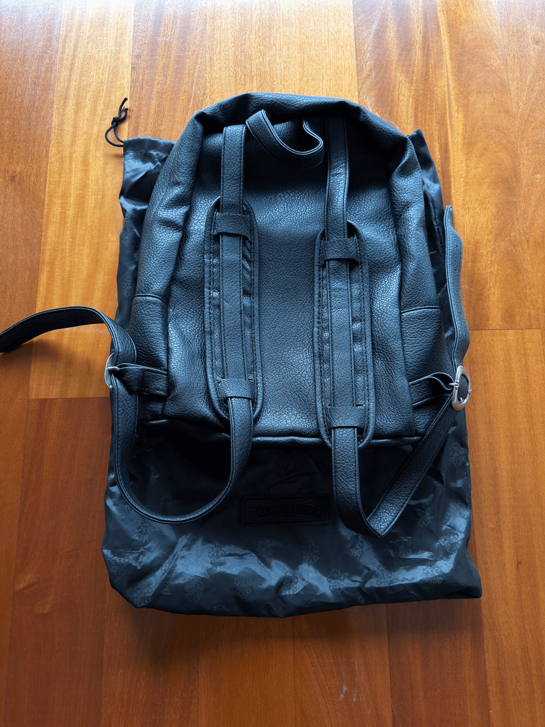 Black backpack and adjustable straps, back