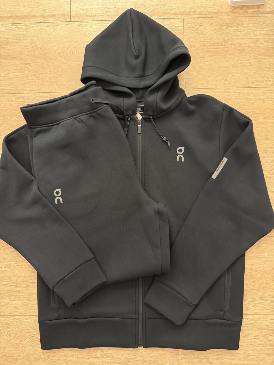 Black zip-up hoodie and trousers