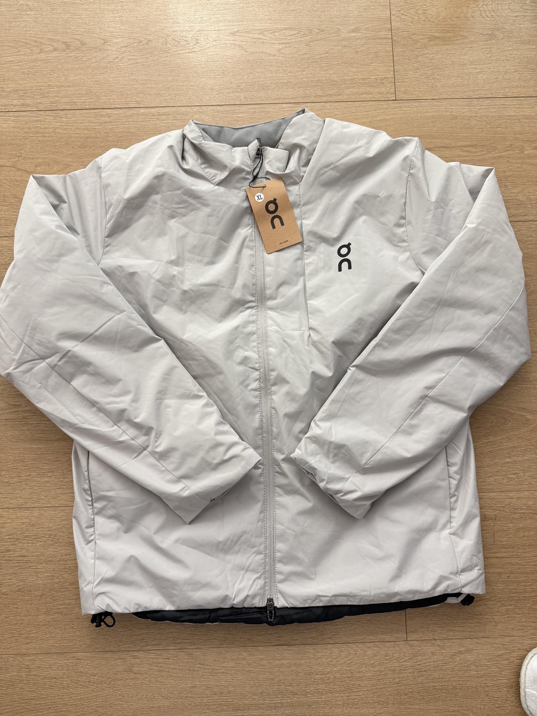 Light-grey padded jacket, front
