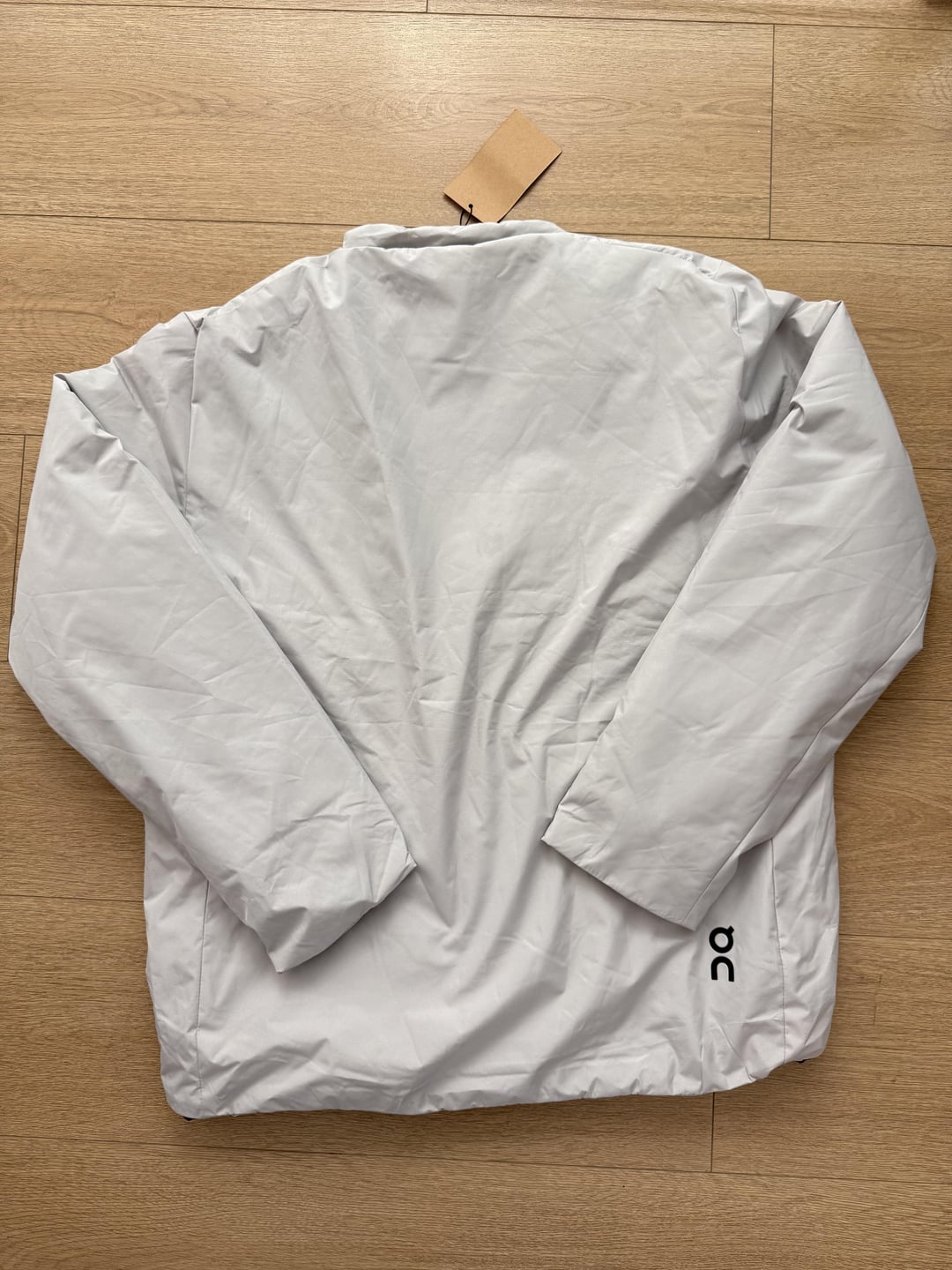 Light-grey padded jacket, back