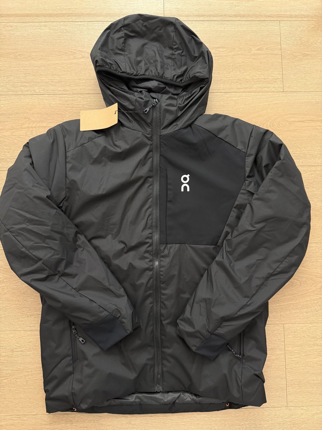 Black padded jacket, front