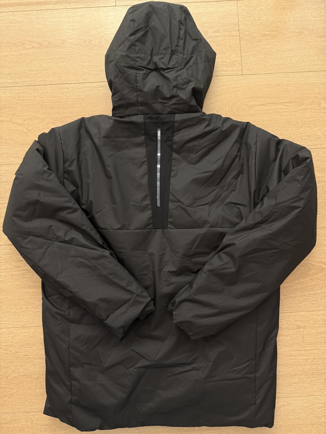 Black padded jacket, back